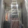 Compact pull down attic ladder